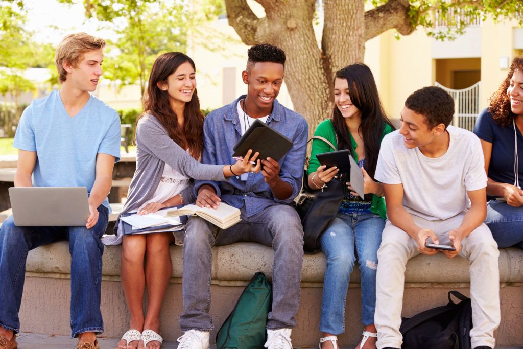 Group of high school students working on project